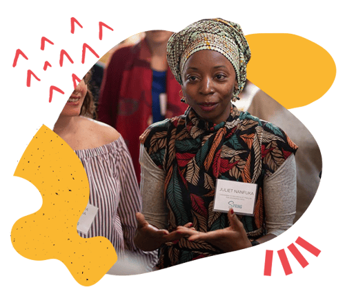 Female facilitator, warmly carrying out the in-person activities of the Reimagining Collaboration program