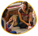 A spring coach listens to two others in a circle