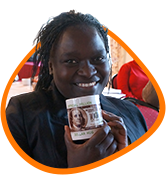 Woman participating in the FIRE program happily holding a cup of coffee with a US dollar design as part of a dynamic