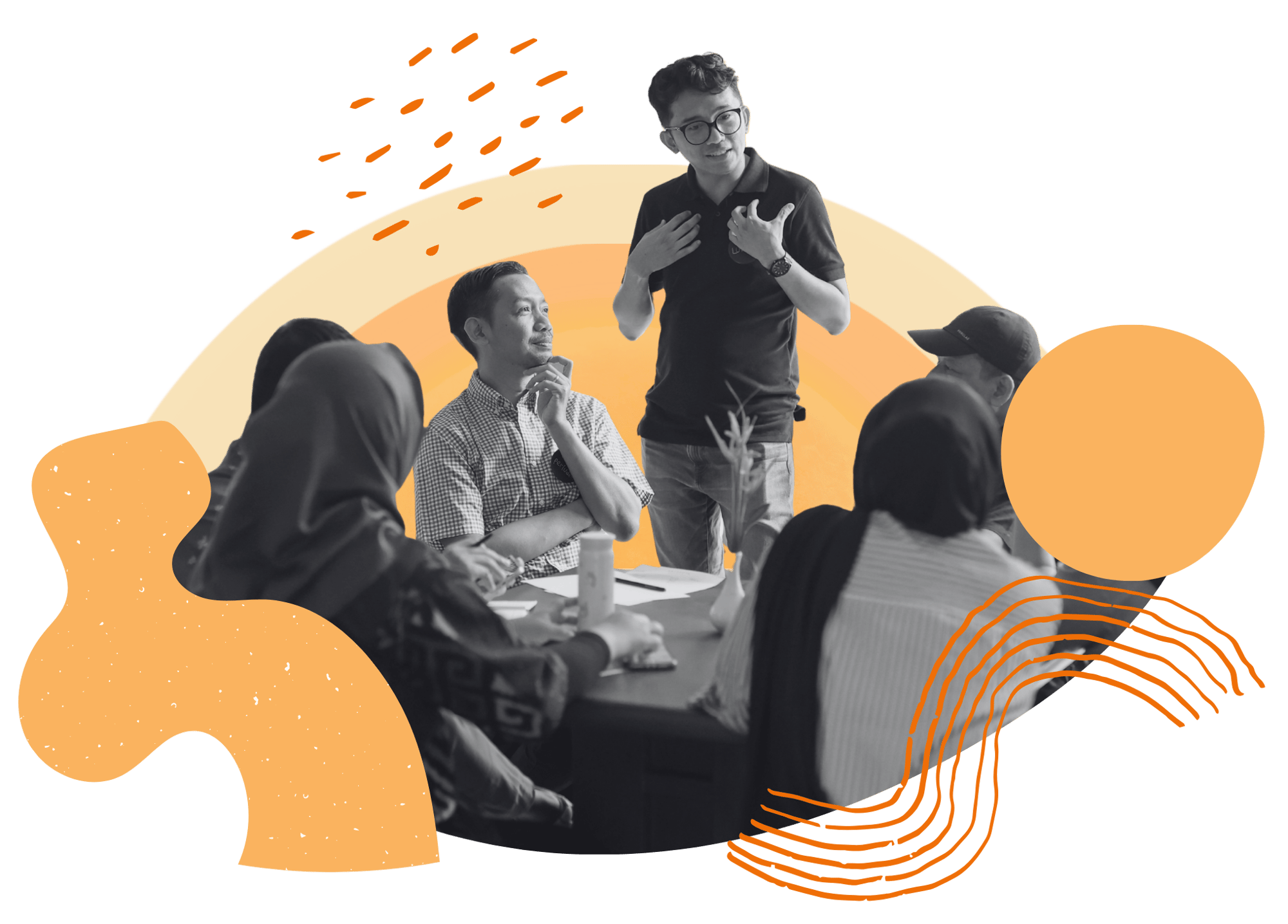 A group of people chat in a circle with a man standing up in the middle