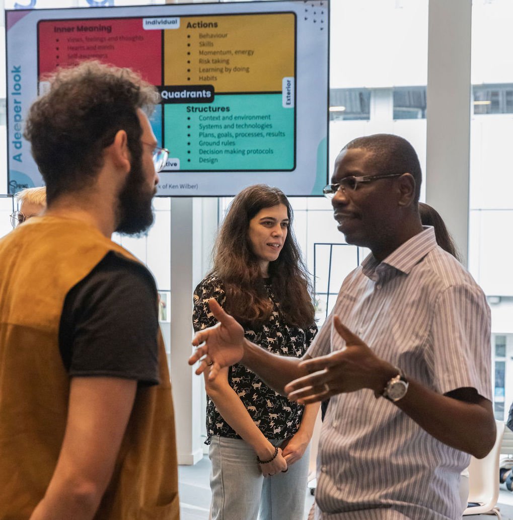 Groups of pairs participate in a state shift exercise during a collaboration training