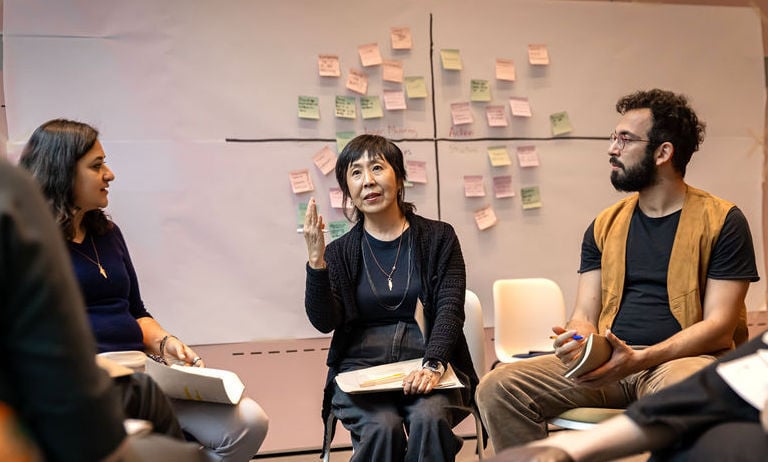 Spring Coaching Lead Márcia Kodama speaks to a group of participants