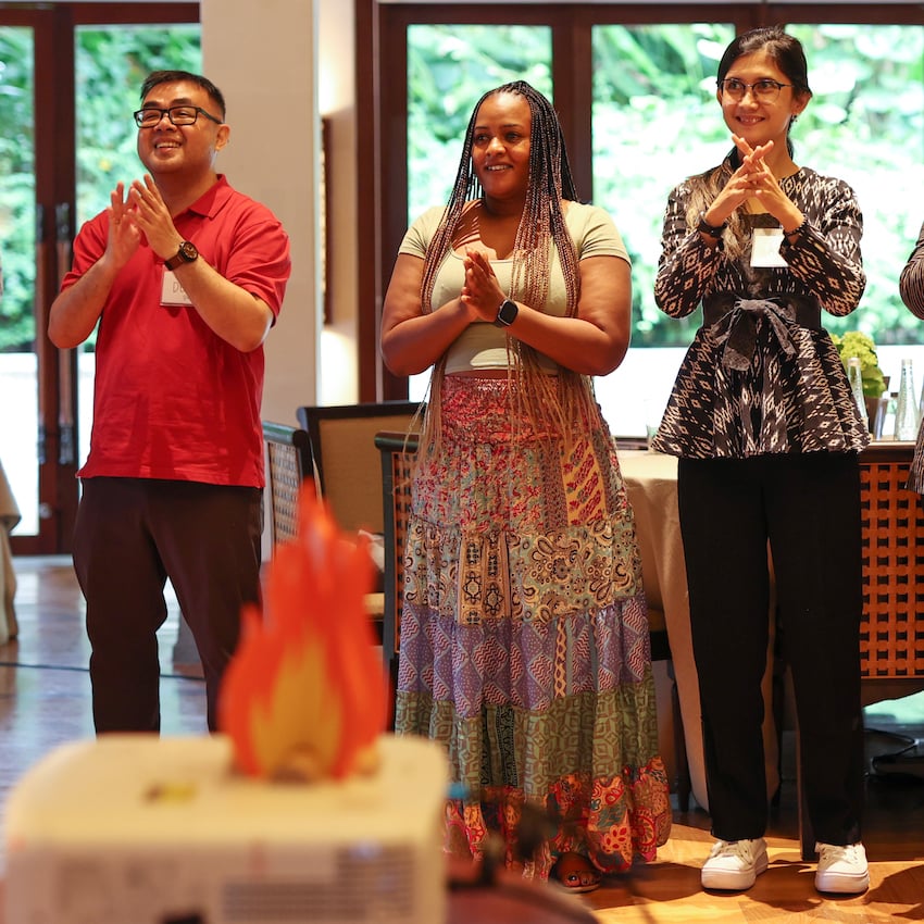 3 people standing and smiling during a FIRE program