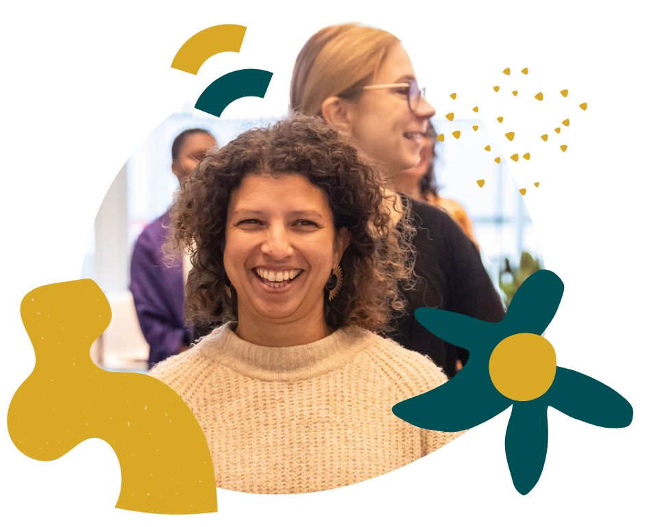 Two women in single file smiling during a state shift exercise